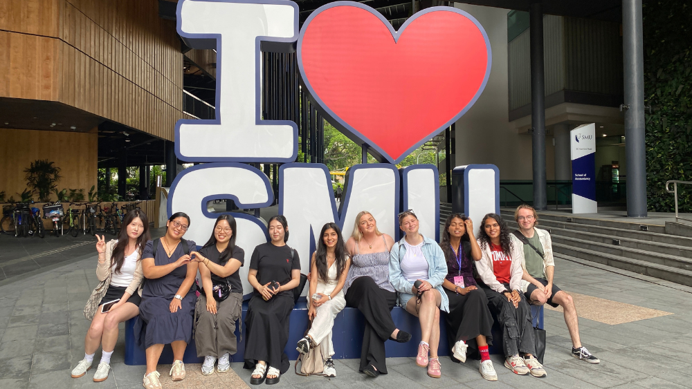 Kylie (second from left) with fellow GSP participants at the I Love SMU installation. 