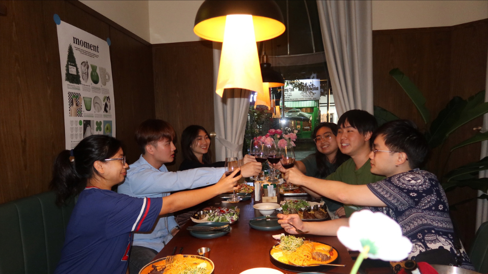 Outside of work, Zheng Feng (2nd from left) relished in local meals with fellow school mates.  