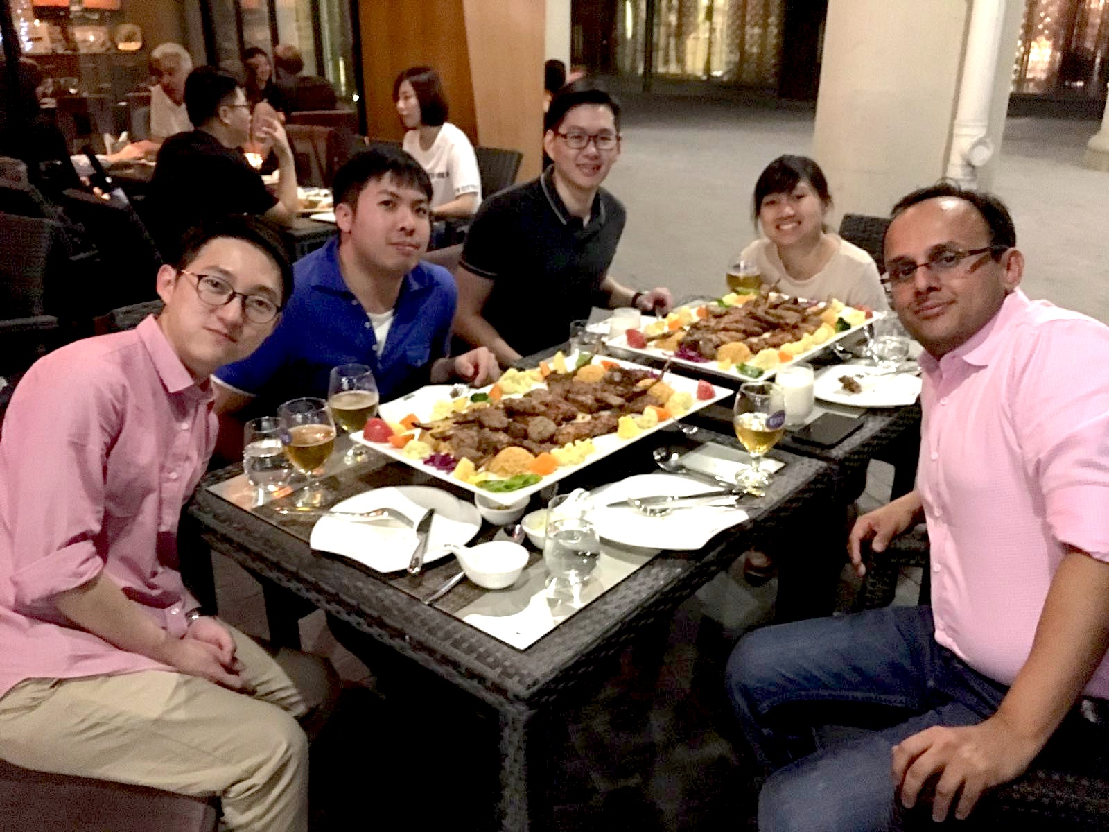 Leon Gim having dinner with Assoc. Prof. Kapil R. Tuli and PhD colleagues. 