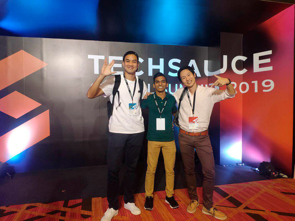 Razzaq with his bosses, Mr Adison and Dr Kanapon, at the Techsauce Conference 2019