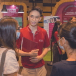Visitors asking questions at SMU Open House