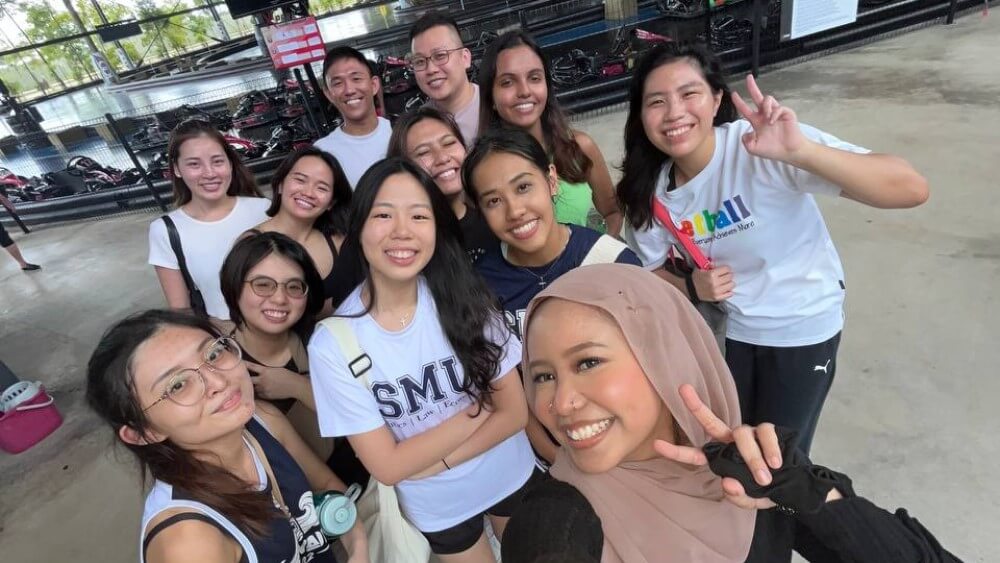 Eka (centre) making memories with her SMU squad 